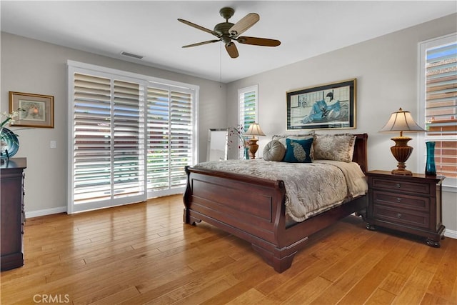 2757 Traditions, Paso Robles, CA 93446 - bedroom featuring multiple windows, access to exterior, light wood-style floors, and a ceiling fan