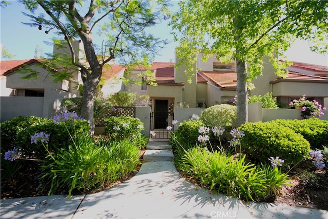 800 Via Colinas, Westlake Village, CA 91362 - mediterranean / spanish home featuring stucco siding, a tiled roof, and a gate