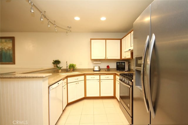 800 Via Colinas, Westlake Village, CA 91362 - kitchen featuring stainless steel appliances, a peninsula, light tile patterned floors, recessed lighting, and under cabinet range hood