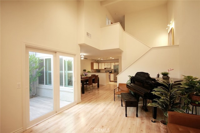 800 Via Colinas, Westlake Village, CA 91362 - sitting room with a high ceiling, light wood-style flooring, and stairway