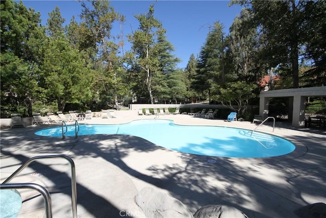 800 Via Colinas, Westlake Village, CA 91362 - community pool featuring a patio and view of wooded area