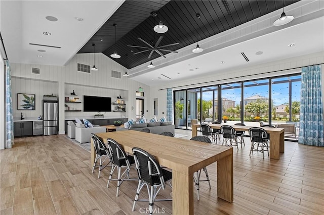 4408 S Grant Paseo, Ontario, CA 91762 - dining space with light wood finished floors, a ceiling fan, and high vaulted ceiling