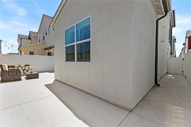 4408 S Grant Paseo, Ontario, CA 91762 - view of side of home featuring a patio, a fenced backyard, and stucco siding
