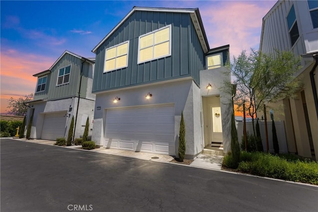 4408 S Grant Paseo, Ontario, CA 91762 - modern farmhouse with board and batten siding, a garage, and stucco siding