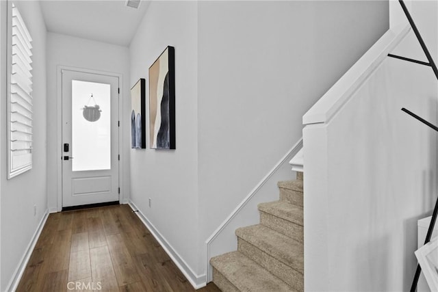 4408 S Grant Paseo, Ontario, CA 91762 - entryway with dark wood finished floors and stairs