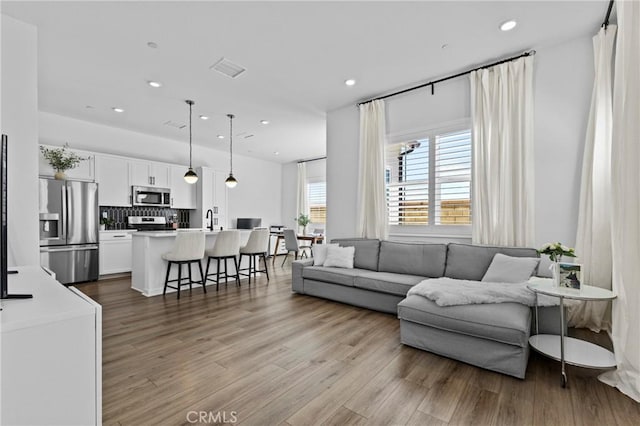 4408 S Grant Paseo, Ontario, CA 91762 - living area with wood finished floors and recessed lighting