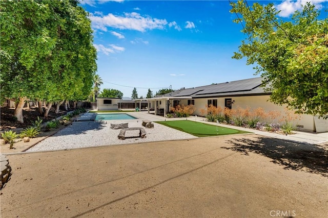 406 Eucalyptus Dr, Redlands, CA 92373 - swimming pool featuring a putting green, a patio, and a shed