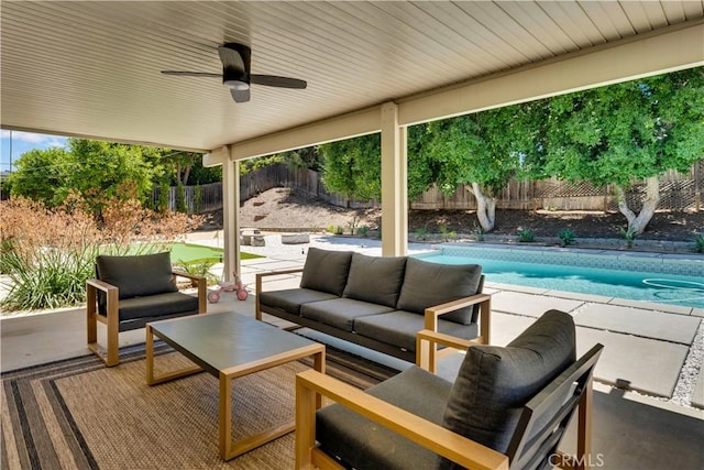 406 Eucalyptus Dr, Redlands, CA 92373 - fenced backyard with outdoor lounge area, a patio area, and ceiling fan