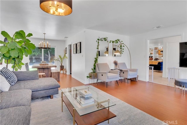 406 Eucalyptus Dr, Redlands, CA 92373 - living area featuring a chandelier and wood finished floors