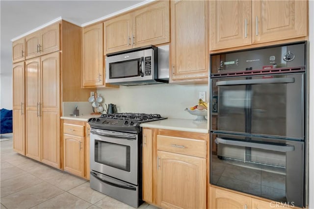 406 Eucalyptus Dr, Redlands, CA 92373 - kitchen featuring stainless steel appliances, light brown cabinets, light countertops, and light tile patterned floors