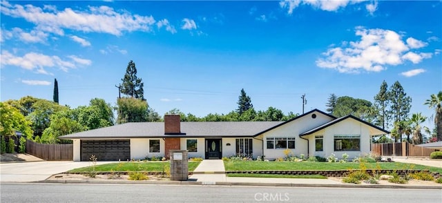 406 Eucalyptus Dr, Redlands, CA 92373 - ranch-style home featuring a chimney, concrete driveway, and an attached garage