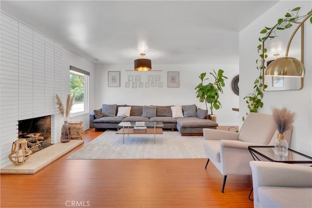406 Eucalyptus Dr, Redlands, CA 92373 - living area with wood finished floors and a fireplace