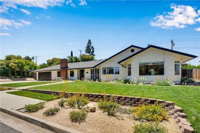406 Eucalyptus Dr, Redlands, CA 92373 - single story home with a chimney, an attached garage, concrete driveway, and stucco siding