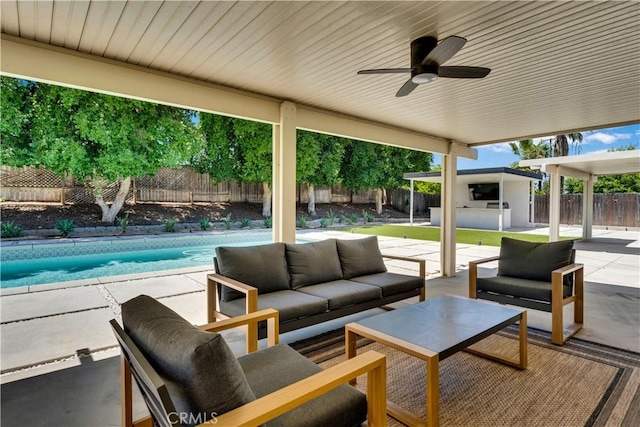 406 Eucalyptus Dr, Redlands, CA 92373 - fenced backyard with an outdoor living space, a patio area, and a ceiling fan