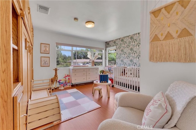 406 Eucalyptus Dr, Redlands, CA 92373 - bedroom with wallpapered walls and wood finished floors