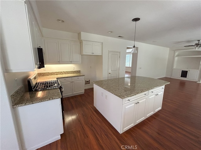 39877 Worthington Pl, Temecula, CA 92591 - kitchen with stainless steel appliances, dark wood-type flooring, white cabinets, and ceiling fan