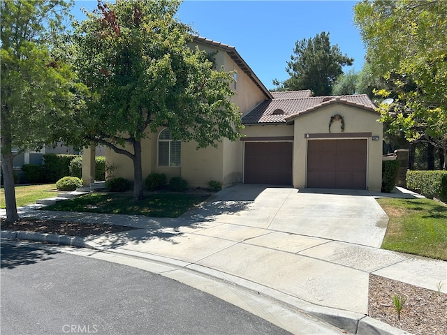 39877 Worthington Pl, Temecula, CA 92591 - view of front of home with a tile roof, a garage, driveway, and stucco siding