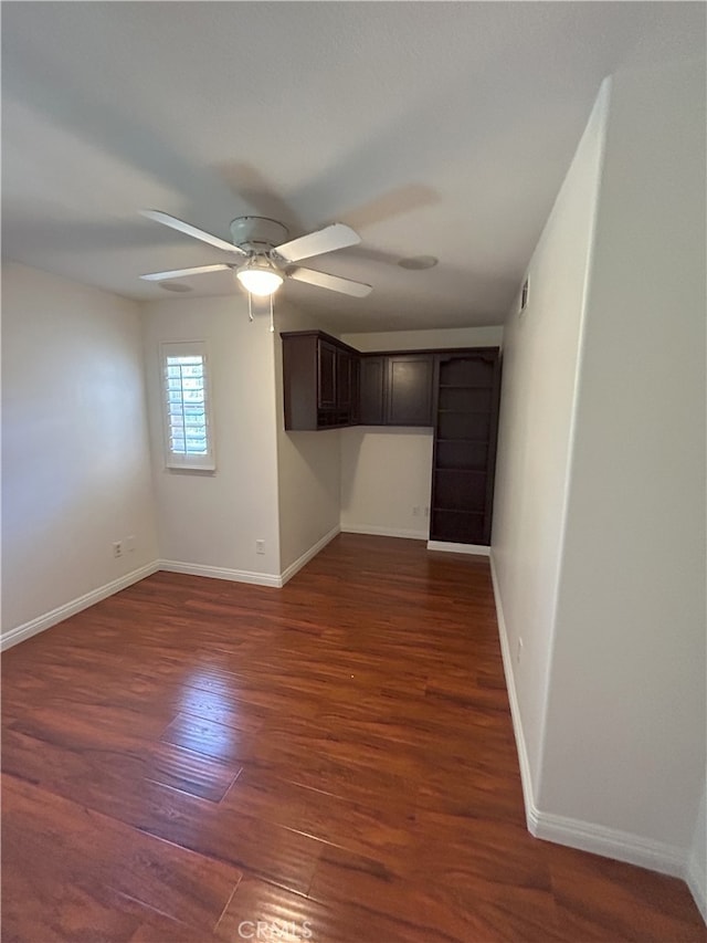 39877 Worthington Pl, Temecula, CA 92591 - empty room featuring ceiling fan and dark wood finished floors