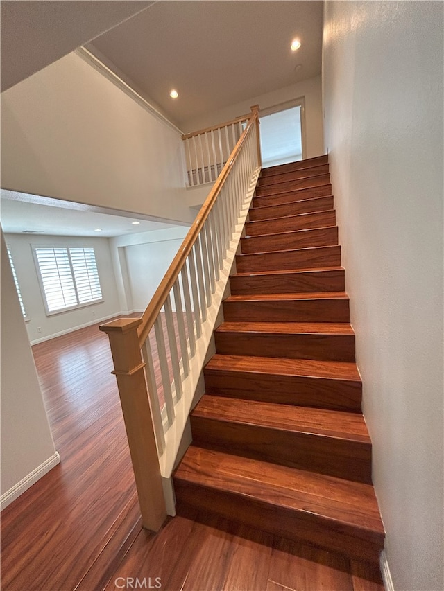 39877 Worthington Pl, Temecula, CA 92591 - staircase featuring wood finished floors and recessed lighting