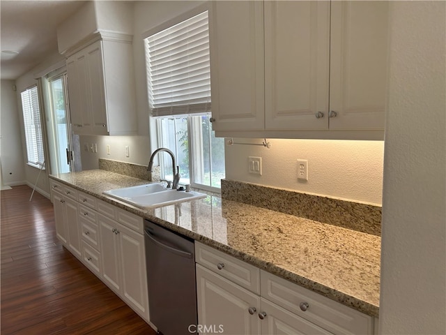 39877 Worthington Pl, Temecula, CA 92591 - kitchen with stainless steel dishwasher, dark wood-style flooring, healthy amount of natural light, white cabinets, and a textured wall