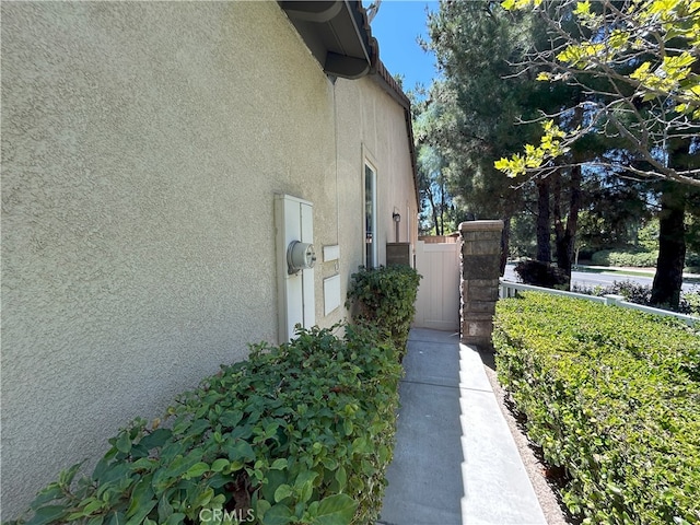 39877 Worthington Pl, Temecula, CA 92591 - view of home's exterior featuring stucco siding and a gate