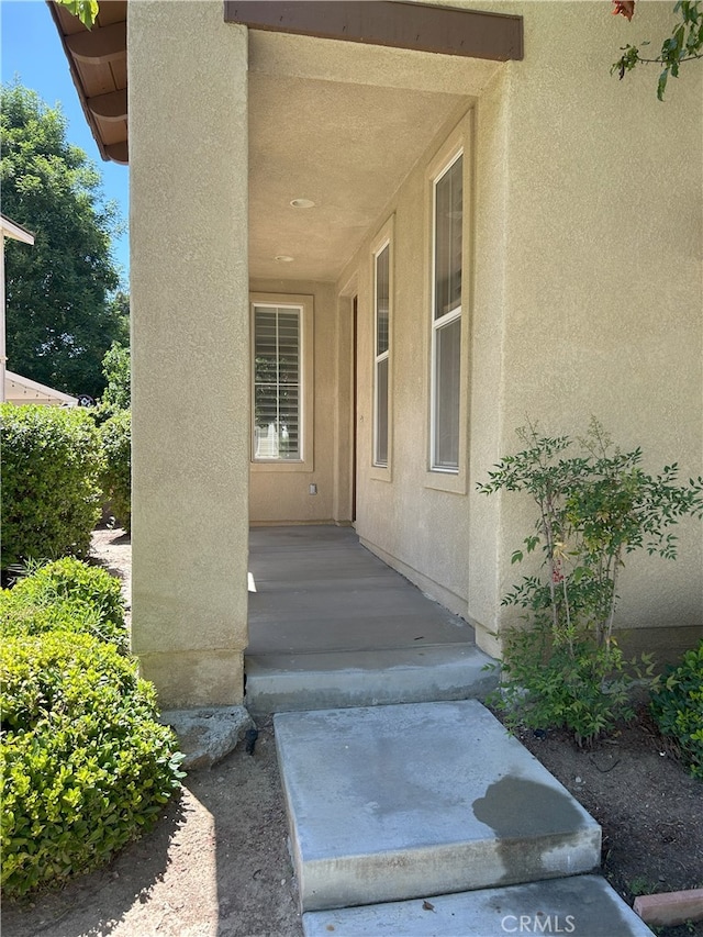 39877 Worthington Pl, Temecula, CA 92591 - doorway to property with stucco siding