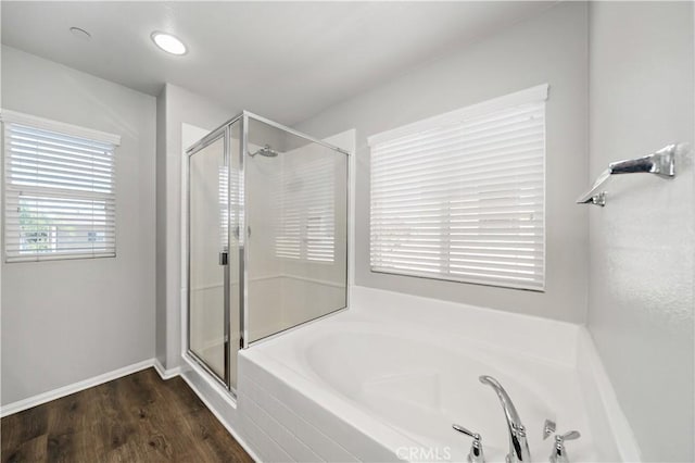 37398 Paseo Violeta Unit 75, Murrieta, CA 92563 - bathroom featuring a garden tub, a stall shower, and wood finished floors