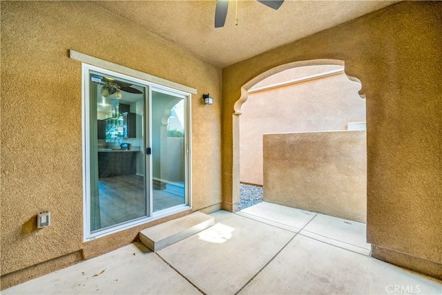 37398 Paseo Violeta Unit 75, Murrieta, CA 92563 - doorway to property with stucco siding and a ceiling fan