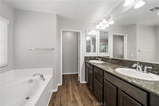 37398 Paseo Violeta Unit 75, Murrieta, CA 92563 - full bathroom featuring double vanity, wood finished floors, and a bath