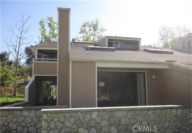 23551 Avenida La Caza Unit 129, Coto De Caza, CA 92679 - back of house featuring a shingled roof