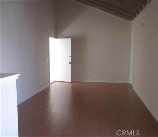 23551 Avenida La Caza Unit 129, Coto De Caza, CA 92679 - spare room with wood finished floors and lofted ceiling