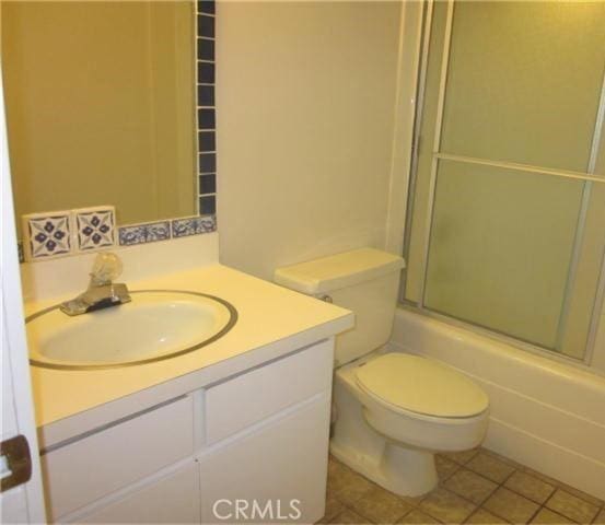 23551 Avenida La Caza Unit 129, Coto De Caza, CA 92679 - full bathroom with vanity, enclosed tub / shower combo, and tile patterned floors