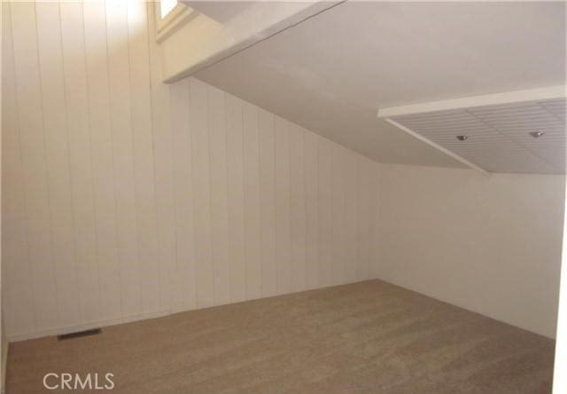 23551 Avenida La Caza Unit 129, Coto De Caza, CA 92679 - mudroom featuring carpet floors and wood walls