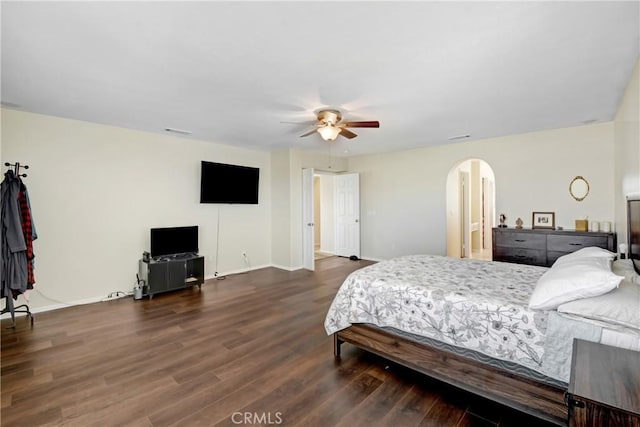 15247 Bandera Way, Victorville, CA 92394 - bedroom with arched walkways, wood finished floors, and ceiling fan