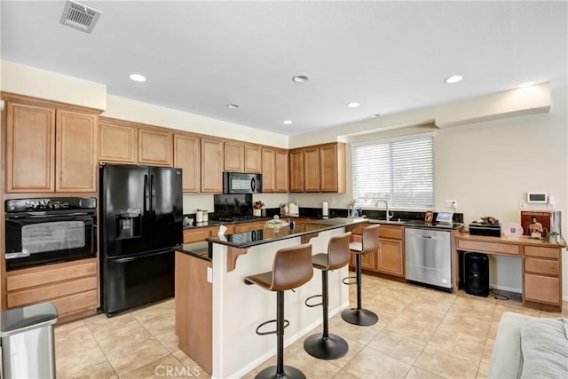 15247 Bandera Way, Victorville, CA 92394 - kitchen with black appliances, a kitchen breakfast bar, dark countertops, a center island, and light tile patterned floors