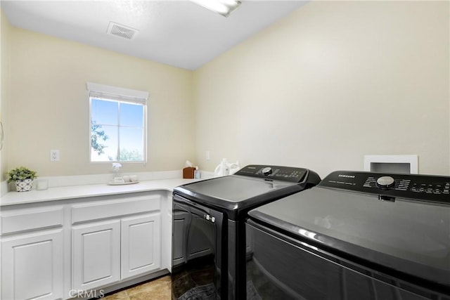 15247 Bandera Way, Victorville, CA 92394 - laundry area featuring washing machine and dryer and cabinet space