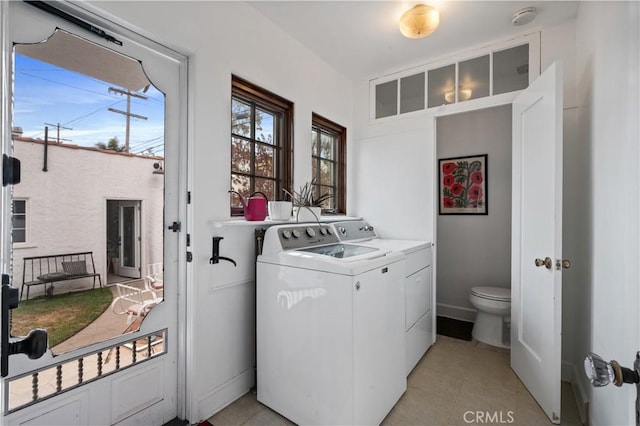 5022 E Broadway, Long Beach, CA 90803 - laundry area featuring washing machine and clothes dryer and light tile patterned floors