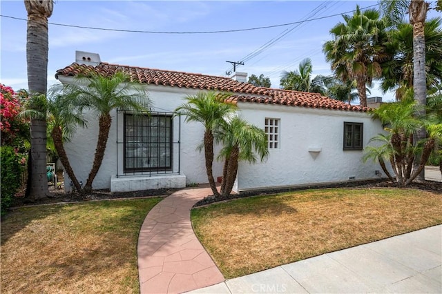 5022 E Broadway, Long Beach, CA 90803 - mediterranean / spanish house featuring stucco siding, a front lawn, and a tiled roof