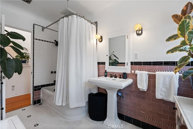 5022 E Broadway, Long Beach, CA 90803 - bathroom with shower / bathtub combination with curtain, tile patterned floors, wainscoting, and tile walls