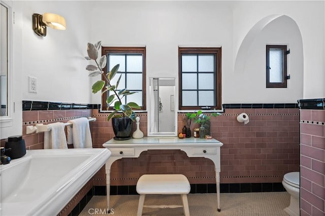 5022 E Broadway, Long Beach, CA 90803 - bathroom with tile walls, tile patterned floors, and wainscoting