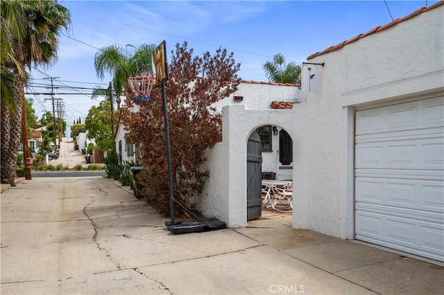 5022 E Broadway, Long Beach, CA 90803 - view of home's exterior with stucco siding and a garage