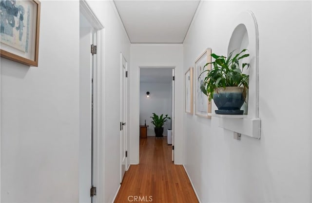 5022 E Broadway, Long Beach, CA 90803 - hallway featuring light wood-type flooring and baseboards
