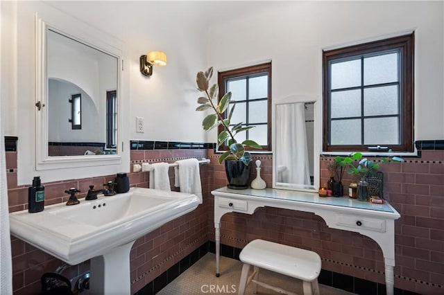 5022 E Broadway, Long Beach, CA 90803 - bathroom featuring tile walls, wainscoting, and tile patterned flooring