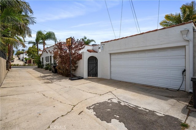 5022 E Broadway, Long Beach, CA 90803 - view of front of house with stucco siding and a garage