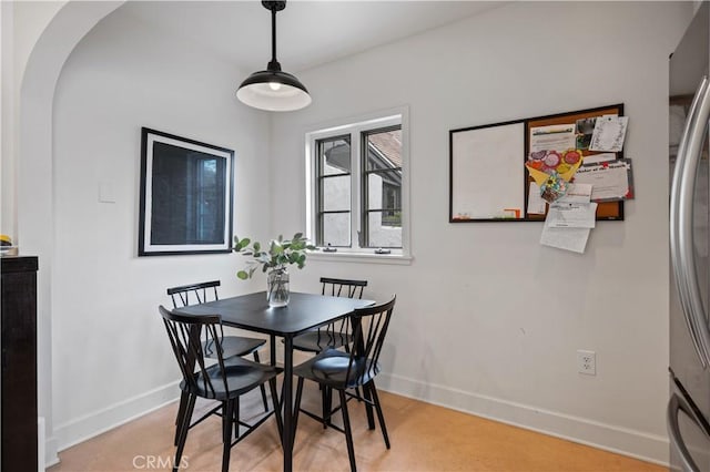 5022 E Broadway, Long Beach, CA 90803 - dining room featuring baseboards and arched walkways