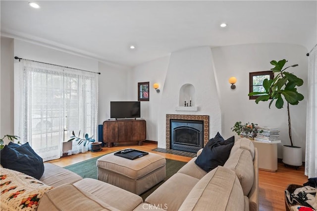 5022 E Broadway, Long Beach, CA 90803 - living room with plenty of natural light, wood finished floors, a tiled fireplace, and recessed lighting