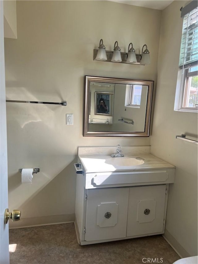 25521 17th St, San Bernardino, CA 92404 - bathroom with vanity and baseboards