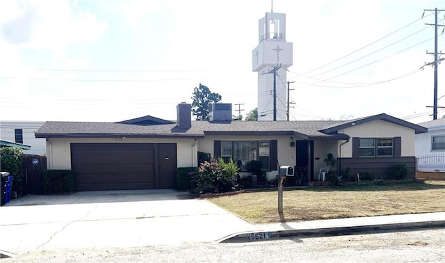 25521 17th St, San Bernardino, CA 92404 - view of front of home with an attached garage, driveway, stucco siding, and a front yard