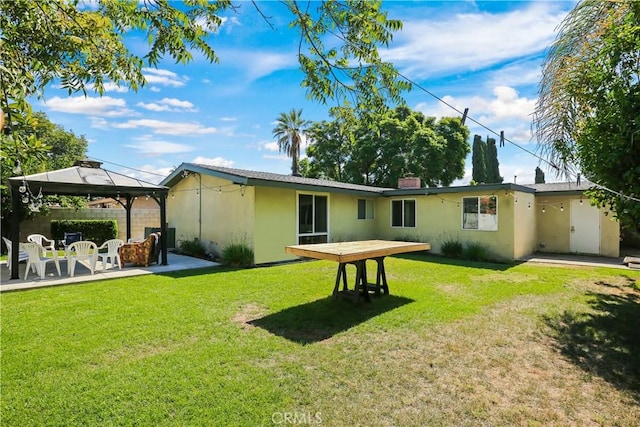 1305 W Beverly Dr, Orange, CA 92868 - back of house featuring stucco siding, a patio area, and a gazebo