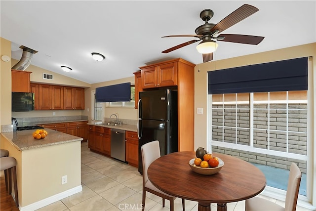 1305 W Beverly Dr, Orange, CA 92868 - kitchen with black appliances, vaulted ceiling, a ceiling fan, light tile patterned floors, and a peninsula